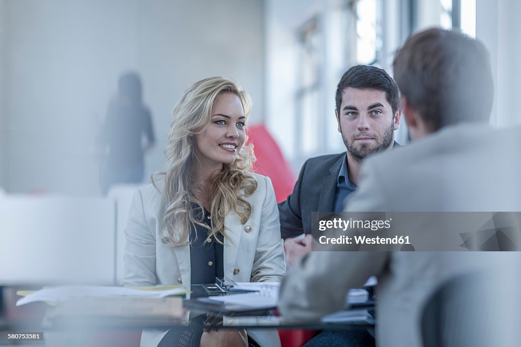 Consultant advising a young couple