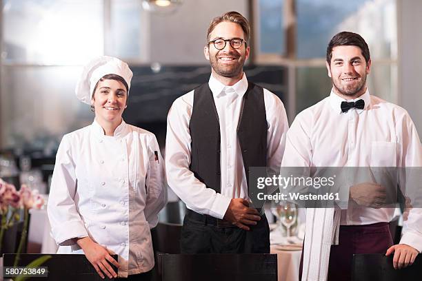 restaurant employees receiving guests - chef team stock pictures, royalty-free photos & images