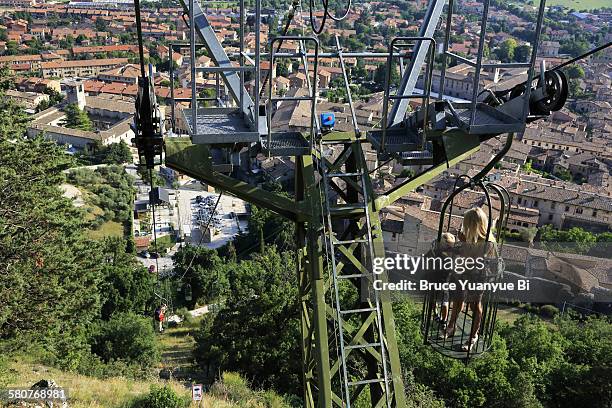 cable-car from town to top of mountain ingino - overhead cable car stock pictures, royalty-free photos & images