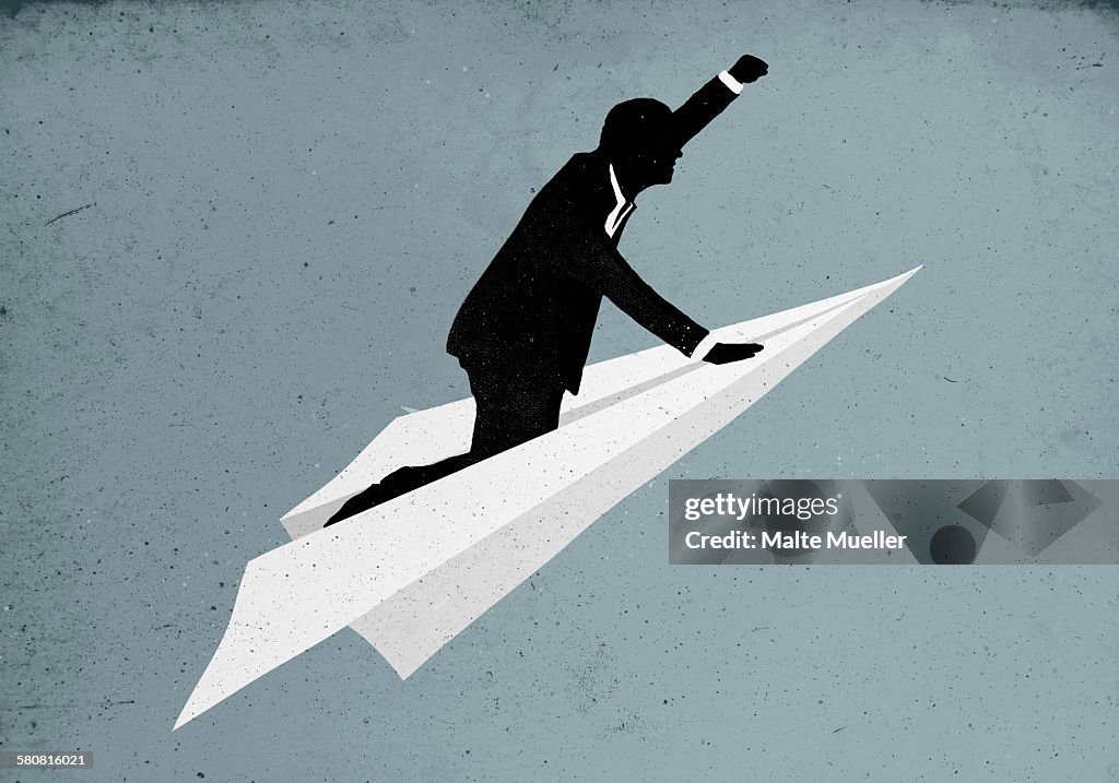 Illustrative image of businessman flying on paper plane