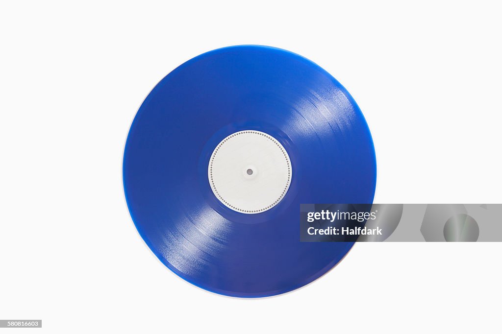 Close-up of blue record on white background