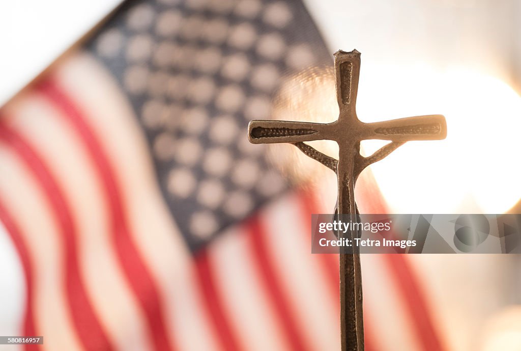 USA, New Jersey, Cross with American flag in background