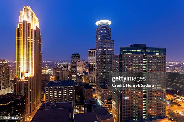 usa, minnesota, minneapolis, downtown district at night - minneapolis downtown stock pictures, royalty-free photos & images