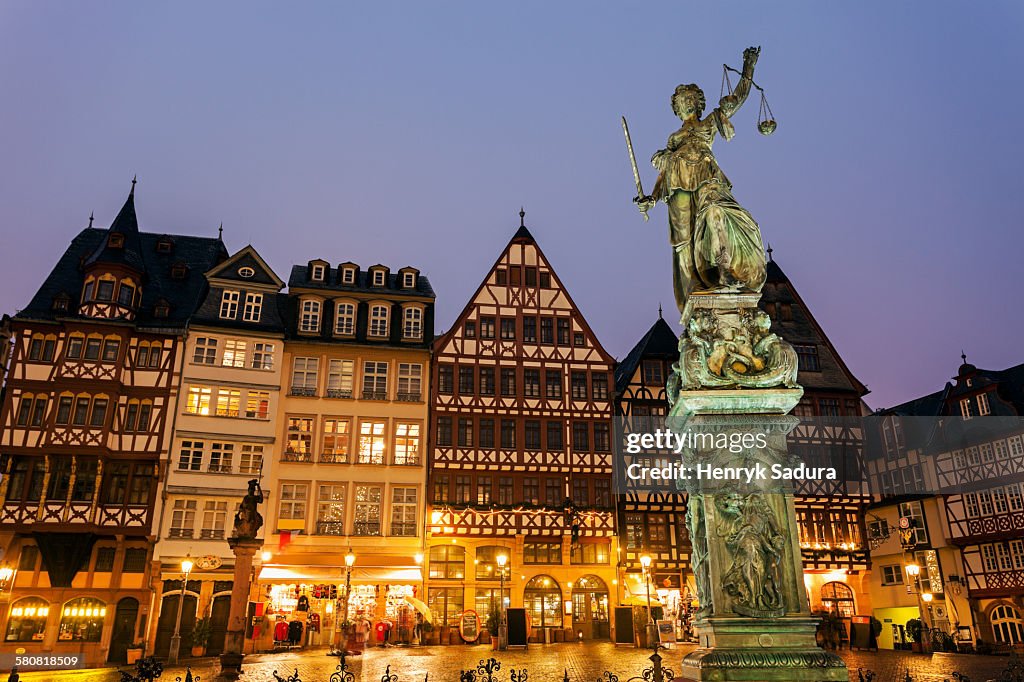 Germany, Hesse, Frankfurt, Romerberg Plaza, Statue on illuminated square