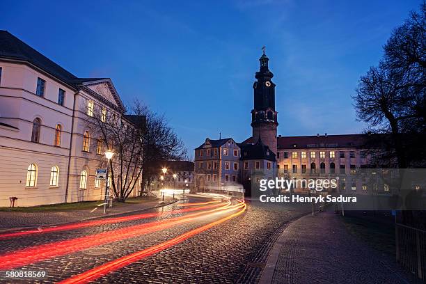 germany, thuringia, weimar, light trails in old town street - weimar foto e immagini stock