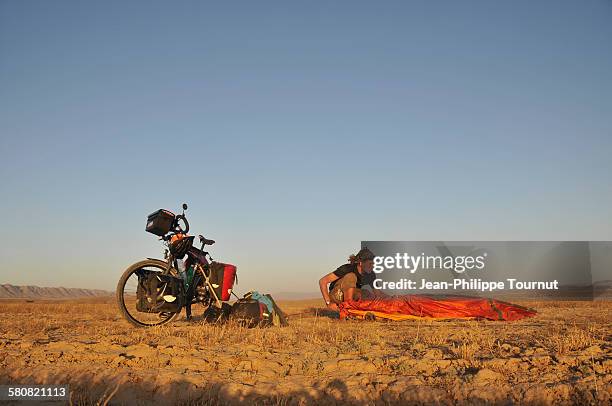 the freedom of travelling by bike around the world - bivouac stock pictures, royalty-free photos & images