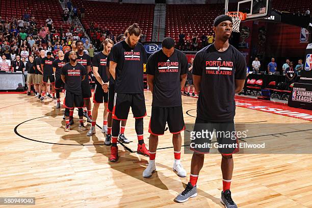 The Portland Trail Blazers stand for the national anthem before the game against the Utah Jazz during the 2016 NBA Las Vegas Summer League on July...