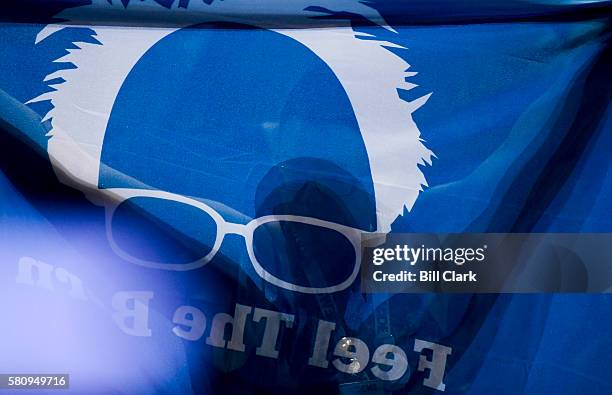 Bernie Sanders delegate hold up a Bernie flag on the floor at the Democratic National Convention in Philadelphia on Monday, July 25, 2016.