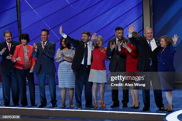 Rep. Linda Sánchez stands with members of the Congressional Hispanic Caucus after delivering remarks on the first day of the Democratic National...