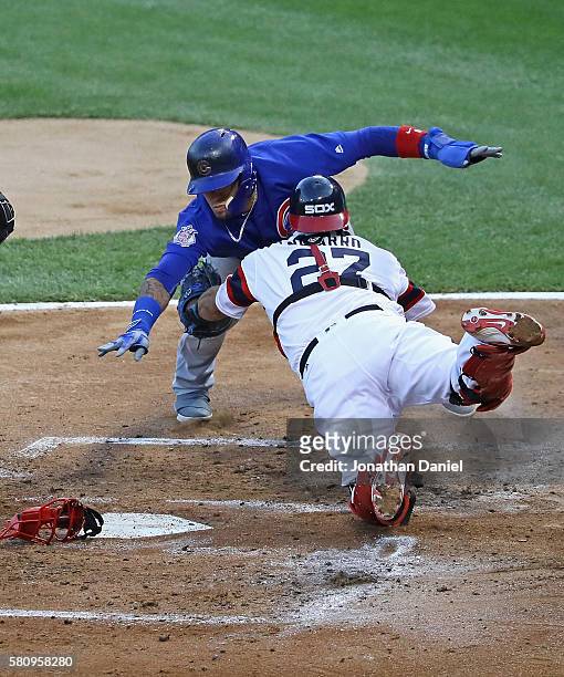 Javier Baez of the Chicago Cubs is tagged out trying to reach for the plate by Dioner Navarro of the Chicago White Sox in the 3rd inning at U.S....