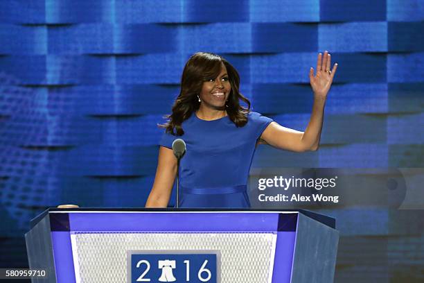 First lady Michelle Obama waves to the crowd before delivering remarks on the first day of the Democratic National Convention at the Wells Fargo...