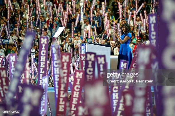 First lady Michelle Obama acknowledges the crowd before delivering remarks on the first day of the Democratic National Convention at the Wells Fargo...