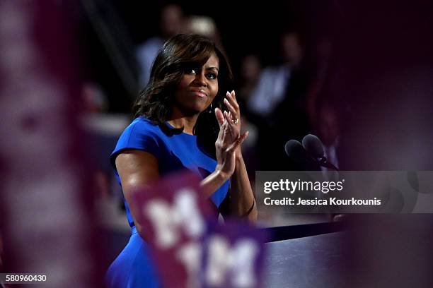 First lady Michelle Obama acknowledges the crowd during her speech on the first day of the Democratic National Convention at the Wells Fargo Center,...