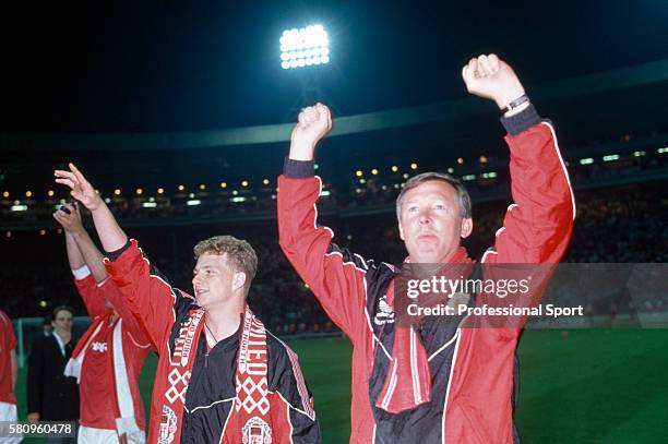 Manchester United manager Alex Ferguson alongside Mark Robins as they celebrate United's victory in the FA Cup Final replay against Crystal Palace at...