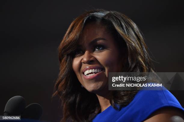 First Lady Michelle Obama addresses delegates on Day 1 of the Democratic National Convention at the Wells Fargo Center in Philadelphia, Pennsylvania,...