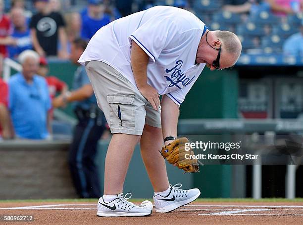 Kansas City Chiefs head coach Andy Reid tried to catch the first pitch from his wife, Tammy Reid, before the game against the Kansas City Royals on...