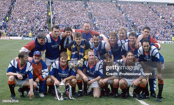 The Glasgow Rangers team celebrate after their victory in the Scottish FA Cup Final between Glasgow Rangers and Airdrieonians at Hampden Park in...