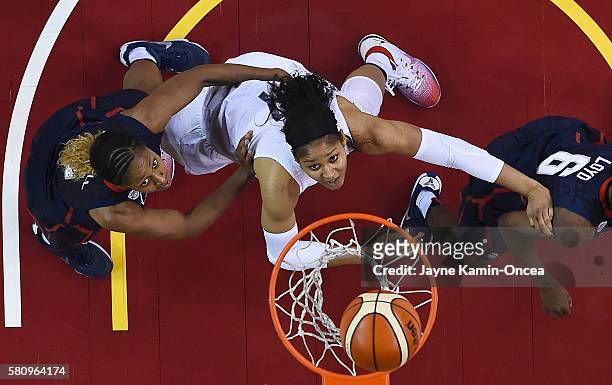 Maya Moore of the USA Basketball Women's National team drives to the basket past Jewell Loyd and Tiffany Mitchell of the USA Basketball Women's...
