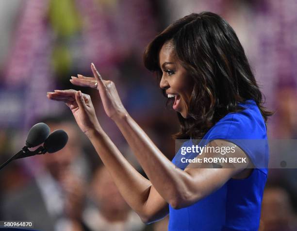 First Lady Michelle Obama addresses delegates on Day 1 of the Democratic National Convention at the Wells Fargo Center in Philadelphia, Pennsylvania,...