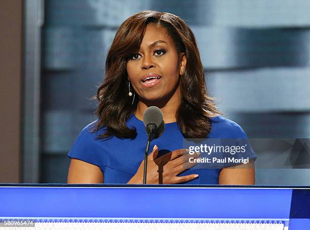 First lady Michelle Obama delivers remarks on the first day of the Democratic National Convention at the Wells Fargo Center, July 25, 2016 in...