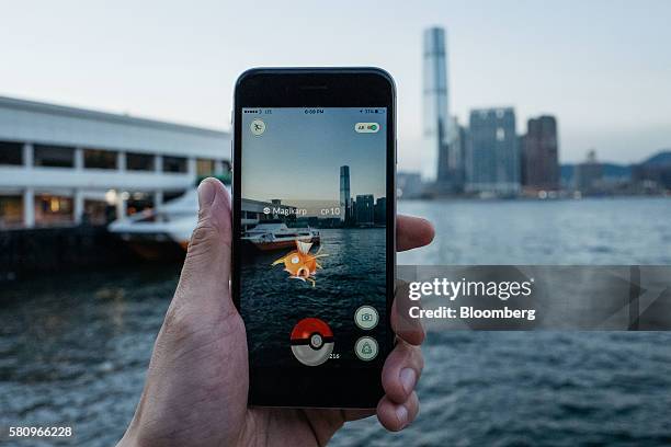 The Magikarp character of Nintendo Co.'s Pokemon Go augmented-reality game, developed by Niantic Inc., is seen in front of the International Commerce...