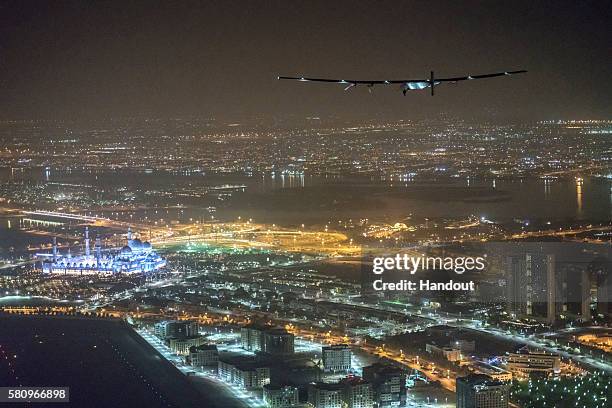 In this handout image supplied by Jean Revillard, Solar Impulse 2, Solar Impulse2, the solar powered plane, piloted by Swiss pioneer Bertrand Piccard...