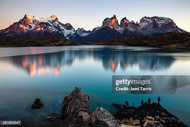 tourists photographing torres del paine - patagonien stock-fotos und bilder