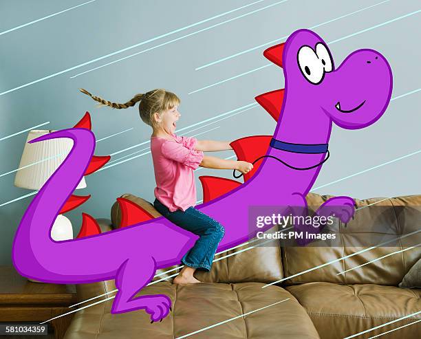 little girl riding illustrated dragon - personaje de ficción fotografías e imágenes de stock