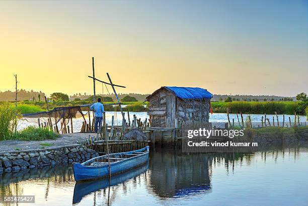 sunset at fish farm - kochi india stock pictures, royalty-free photos & images