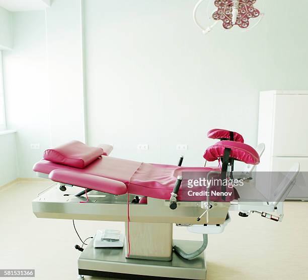 gynecological chair in gynecological room - pelvic exam stock pictures, royalty-free photos & images