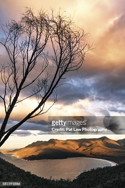 dramatic clouds movement and colorful sunset - wineglass bay stock pictures, royalty-free photos & images