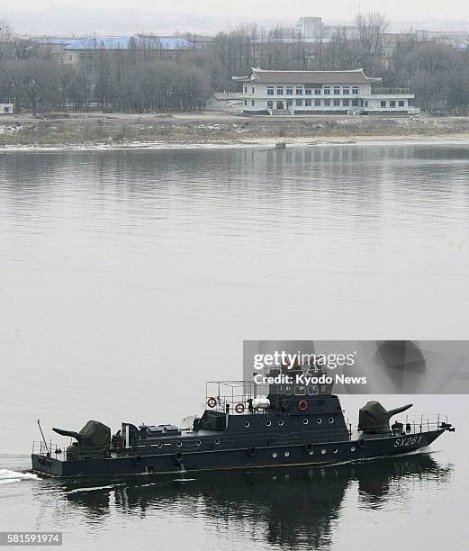 China - Photo taken from Dandong on the Chinese side shows a Chinese boat patrolling the Yalu River, running between China and North Korea , on Dec....