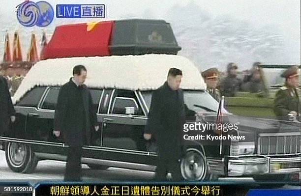 China - Photo captured from Hong Kong-based Phoenix Television shows the late North Korean leader Kim Jong Il's heir apparent Kim Jong Un walking...