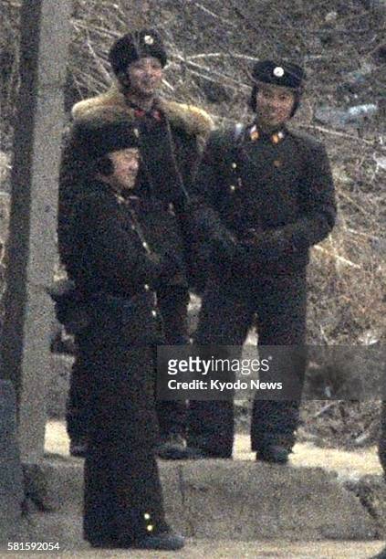 China - Photo taken from Dandong, China on the border with North Korea shows soldiers in North Korea on Dec. 28, 2011. North Korea held leader Kim...
