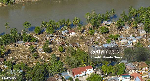 Philippines - Aerial photo taken on Dec. 29 shows a residential area along the Cagayan River devastated by storm-triggered flash flooding in Cagayan...