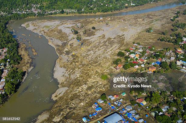 Philippines - Aerial photo taken on Dec. 29 shows a residential area devastated by storm-triggered flash flooding in Cagayan de Oro on Mindanao...