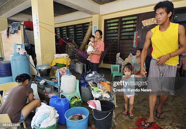 Philippines - Photo taken Dec. 30 shows people living in an elementary school in Cagayan de Oro on the Philippines' Mindanao island after their...