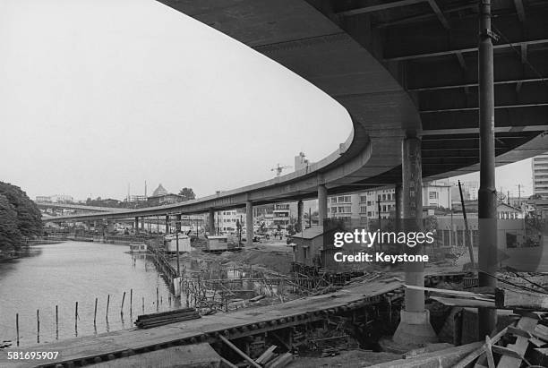 An elevated expressways being built in the Akasaka-mitsuke area of Tokyo, Japan, in preparation for the Tokyo Olympics, 1964.