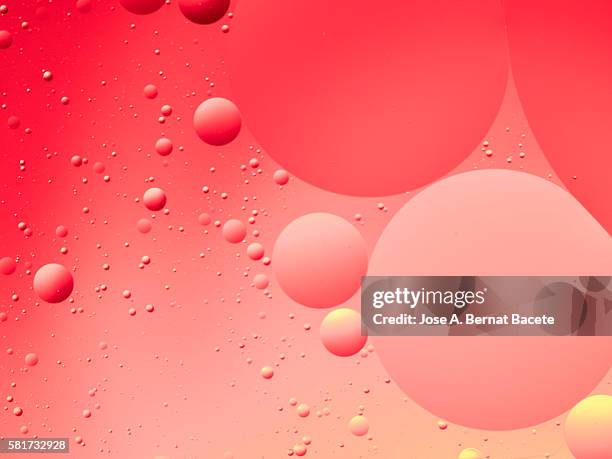 red background bubbles in a circle - color explosion water stock pictures, royalty-free photos & images