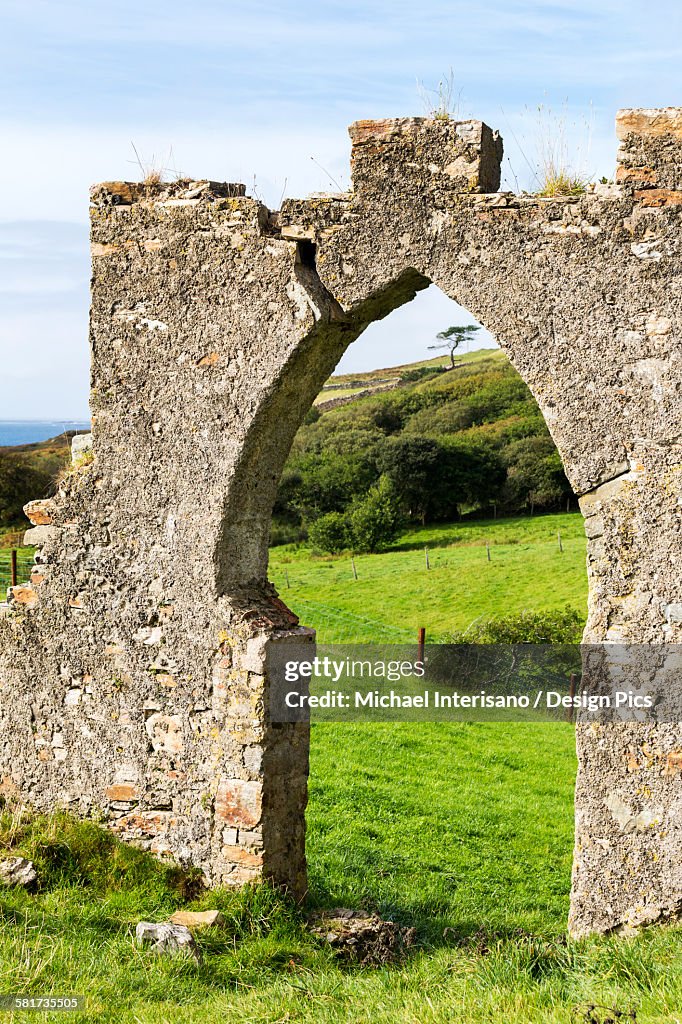 Old stone wall with arched entrance way