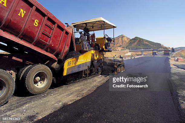 asphalting engine - asphalting stock pictures, royalty-free photos & images