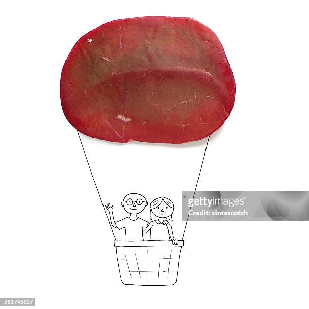 conceptual couple in a hot air balloon - bresaola stock pictures, royalty-free photos & images