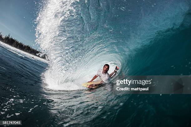 bodyboarder riding through tube wave, puerto rico, usa - surf tube stock-fotos und bilder