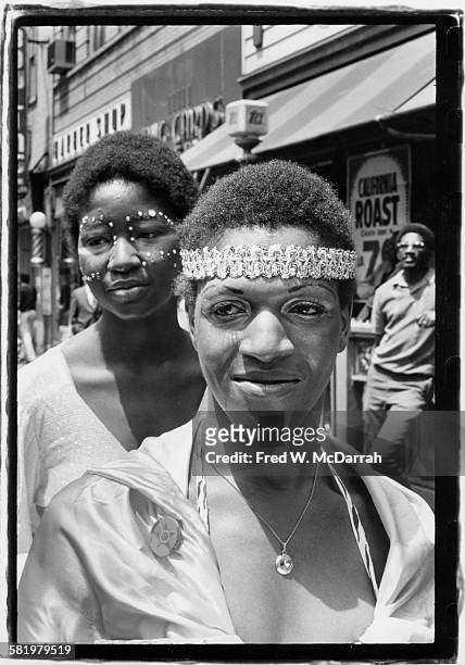 American gay liberation activist Marsha P Johnson and an unidentified woman in facepaint, on 7th Avenue South, between Grove and Christopher streets,...