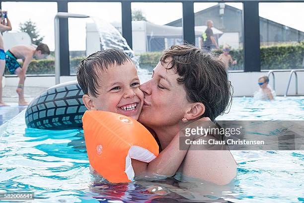 love of a mother - arm floats stock pictures, royalty-free photos & images
