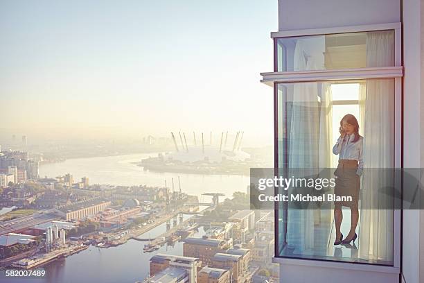 business executive - apartment windows stock pictures, royalty-free photos & images