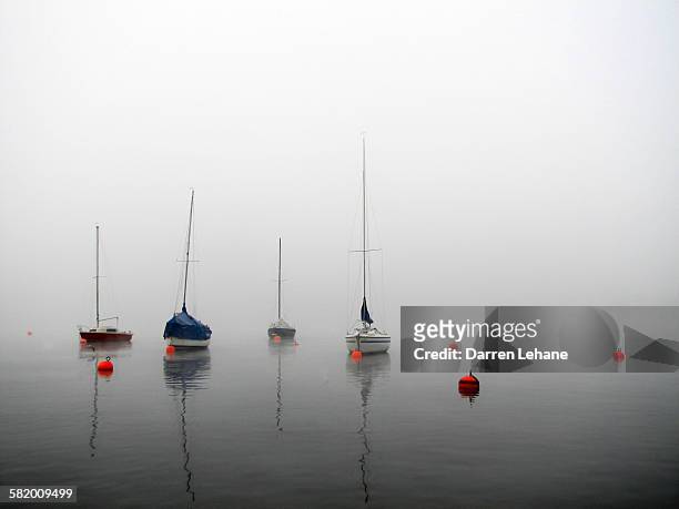boats on misty lake - lake zurich stock pictures, royalty-free photos & images