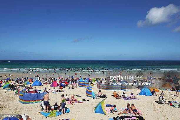 holiday makers at st ives beach - crowded beach stock pictures, royalty-free photos & images