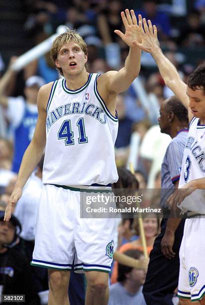 Dirk Nowitzki of the Dallas Mavericks slaps hands with Steve Nash after scoring against the San Antonio Spurs in Game 4 of the second round of the...