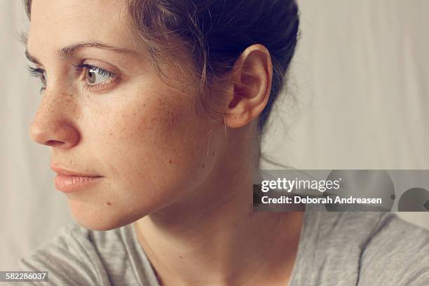 thoughtful woman - freckle stock pictures, royalty-free photos & images